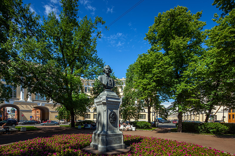 Statue of Mikhail Lomonosov and small garden in the middle of Ploshchad Lomonosova in St Petersburg, Russia