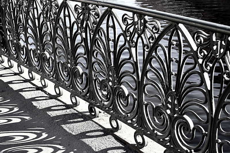 Wrought-iron railings of Demidov Bridge over the Griboedov Canal in St Petersburg, Russia