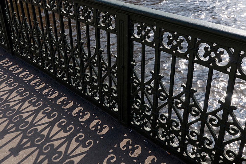 Wrought iron railings of Izmailovskiy Bridge over the Fontanka River in St Petersburg, Russia