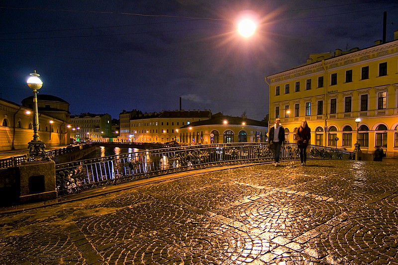 Night view of Maly Konyushenny Bridge over the Moyka River in St Petersburg, Russia