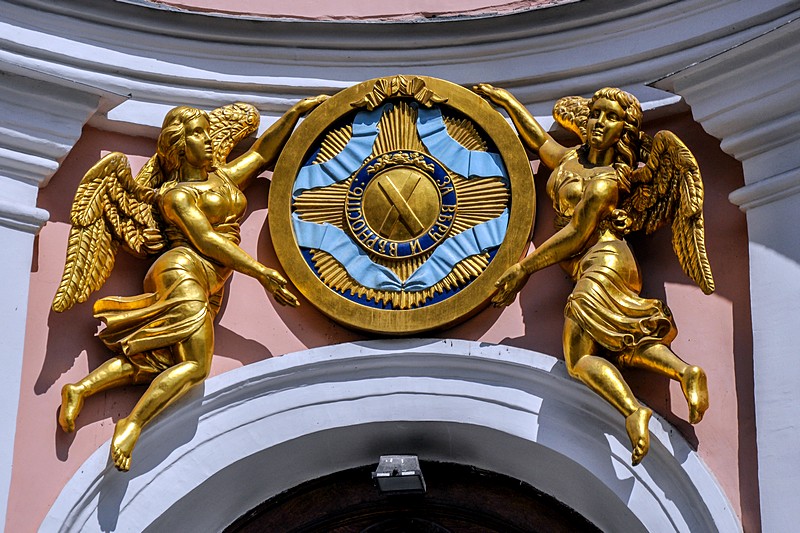 Relief with inscription 'For Faith and Faithfulness' at the entrance to St. Andrew's Cathedral in Saint-Petersburg, Russia