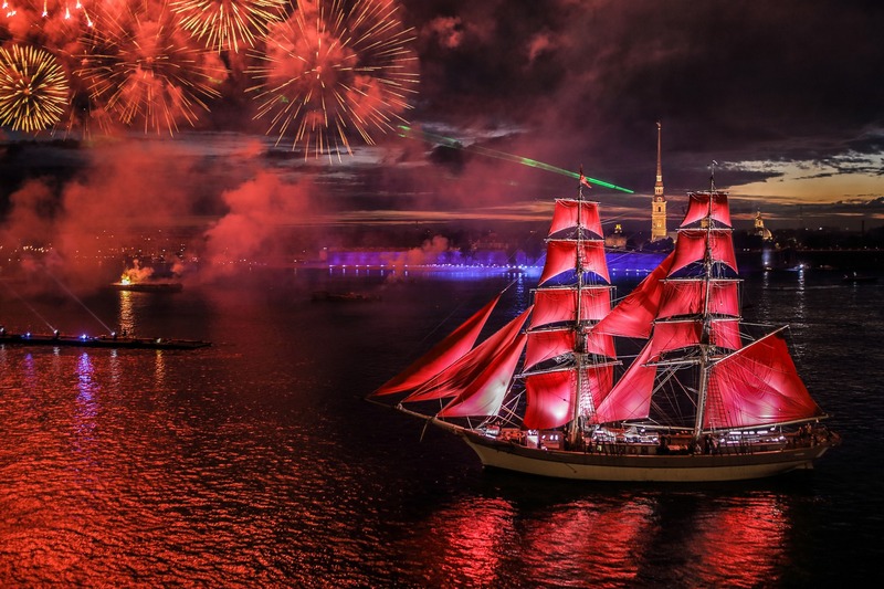 A ship with scarlet sails in front of the Peter and Paul Fortress in St. Petersburg, Russia