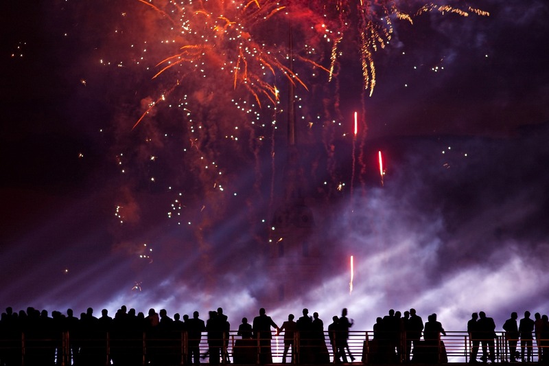 Spectators on a bridge enjoying Scarlet Sails festivities in St. Petersburg, Russia