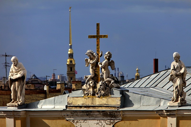 Angels and a cross at the top of St Catherine's Church on Nevsky Prospekt in St Petersburg, Russia