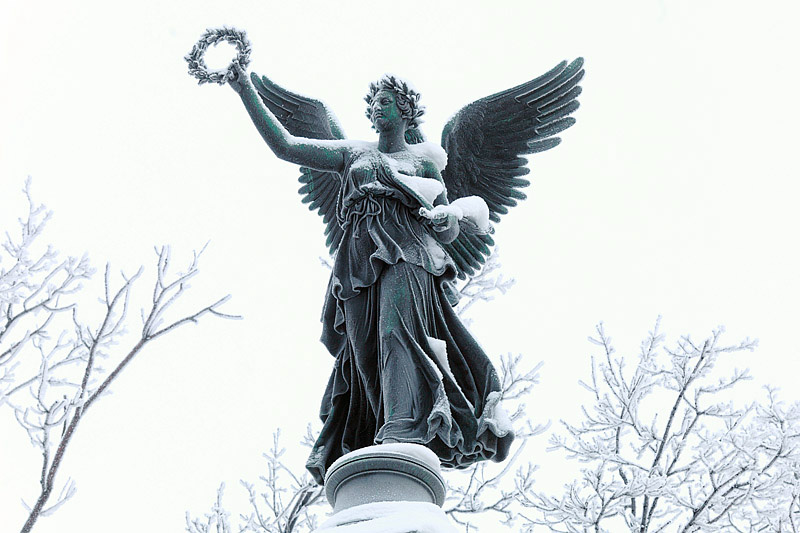 Bronze statue of Nike on the top of the Column of Glory on Konnogvardeiskiy Boulevard in St Petersburg, Russia