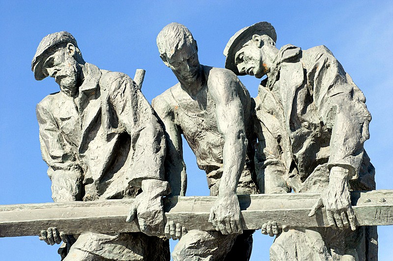 Sculptural group Building City Defenses in front of the Monument to the Heroic Defenders of Leningrad in St Petersburg, Russia