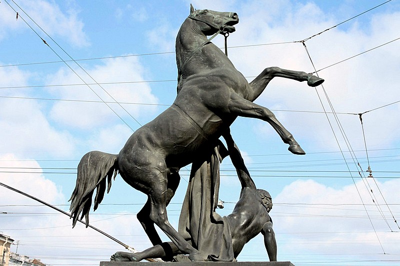 Statue on Anichkov Bridge over the Fontanka River in St Petersburg, Russia