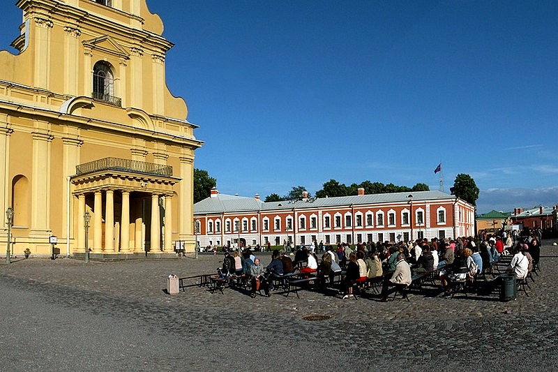 Spectators at a carillion concert opposite the cathedral in Peter and Paul Fortress in St Petersburg, Russia