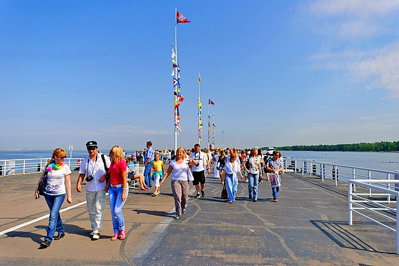 Tourists on Peterhof pier in Peterhof, western suburb of St Petersburg, Russia