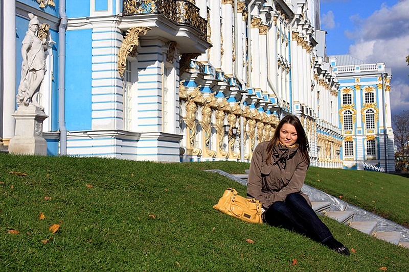 Young lady in front of Catherine Palace in Tsarskoye Selo (Pushkin), south of St Petersburg, Russia