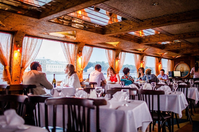 A served table at Astra Riverboat Restaurant in St Petersburg, Russia