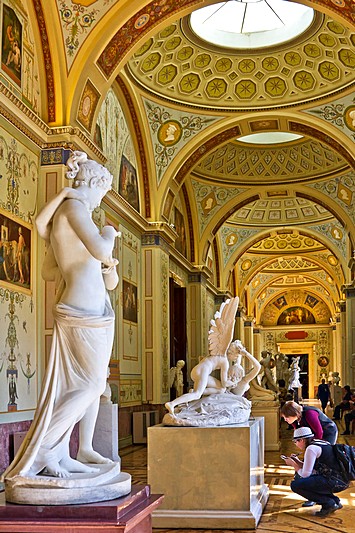 Visitors to the Hermitage in front of statues by Canova in St Petersburg, Russia